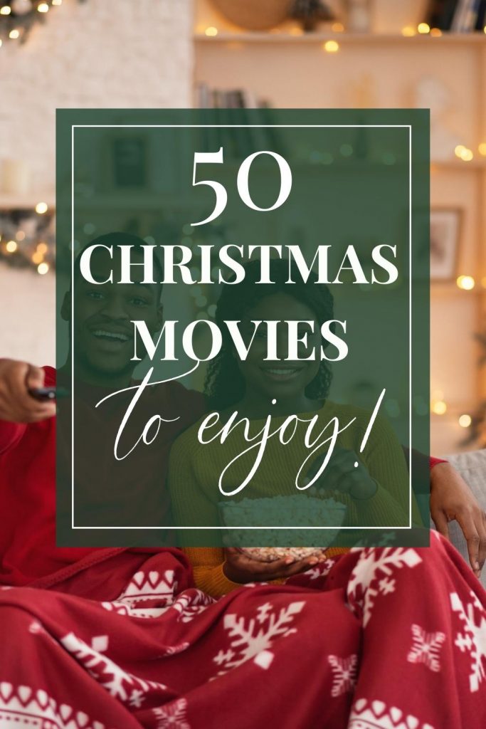 couple in Christmas blanket watching tv with text 50 Christmas movies to enjoy