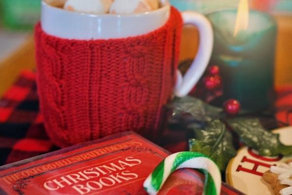 christmas decor with christmas mug, christmas book and candy