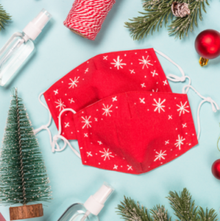 red cloth masks on background with christmas decor