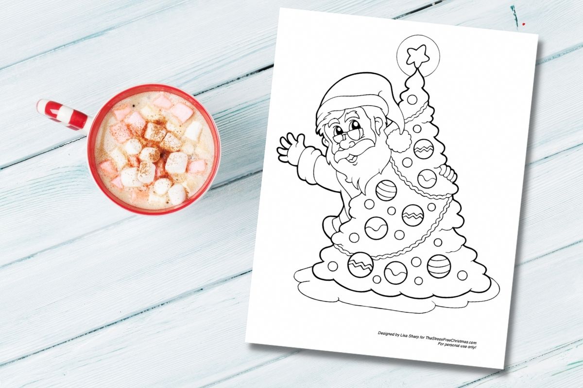 santa coloring page on blue table with cup of hot chocolate 