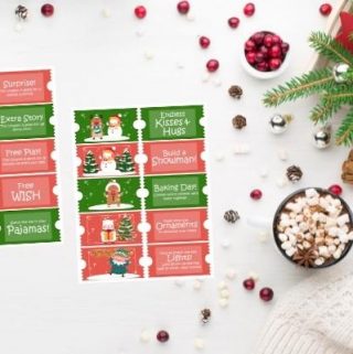 christmas coupons for kids on white table with hot chocolate and christmas decor