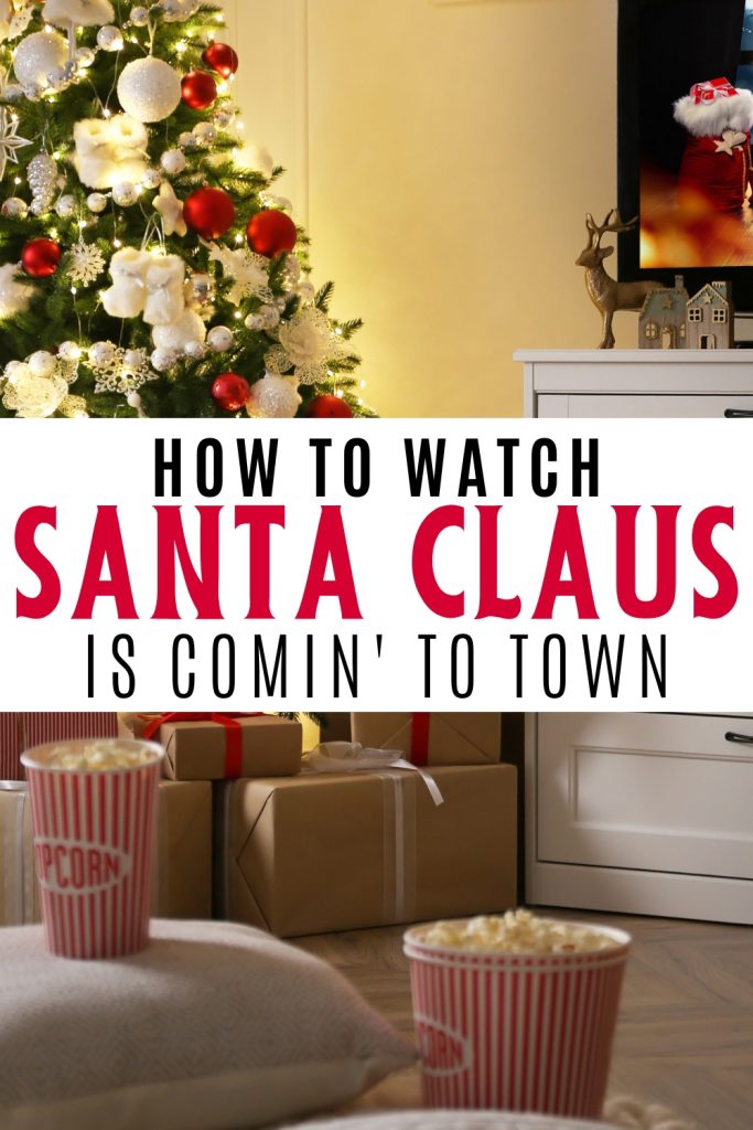 living room with christmas tree and Christmas decor, popcorn on coffee table with tv in background. Text overlay how to watch Santa Claus is Comin' to Town