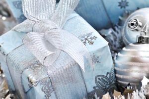 gifts in blue and silver snowflake paper