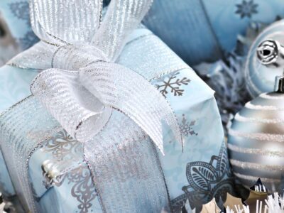 gifts in blue and silver snowflake paper